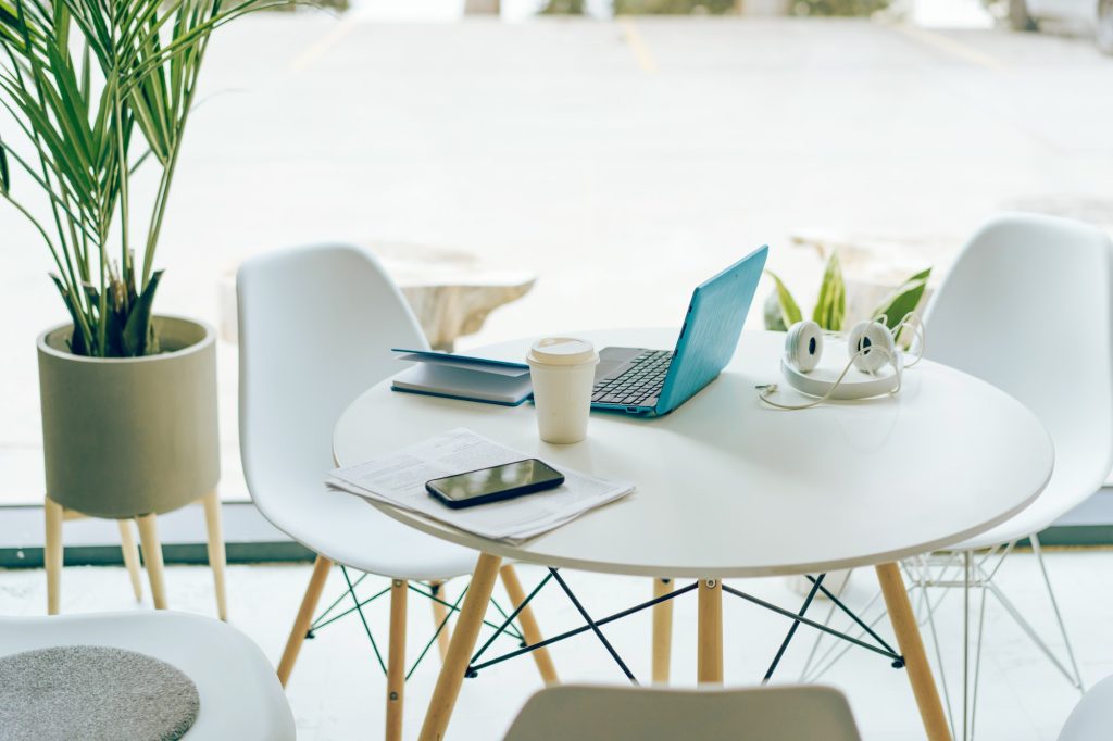 modern workplace, light office, laptop on the table